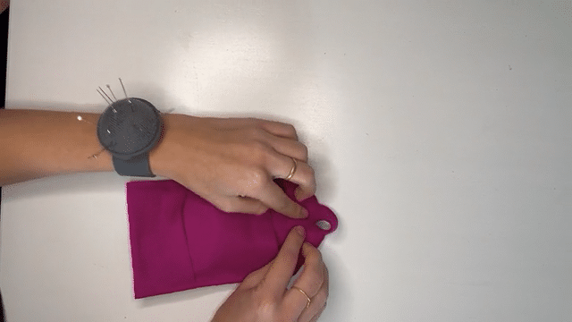 The magenta fabric is folded