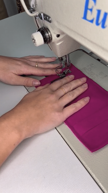 The phone pouch is sewn on the sewing machine