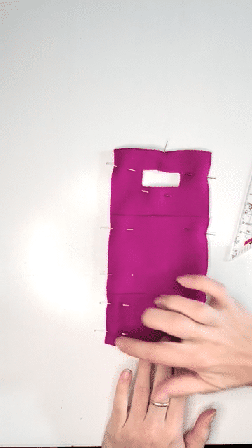 The fabric pieces are pinned together