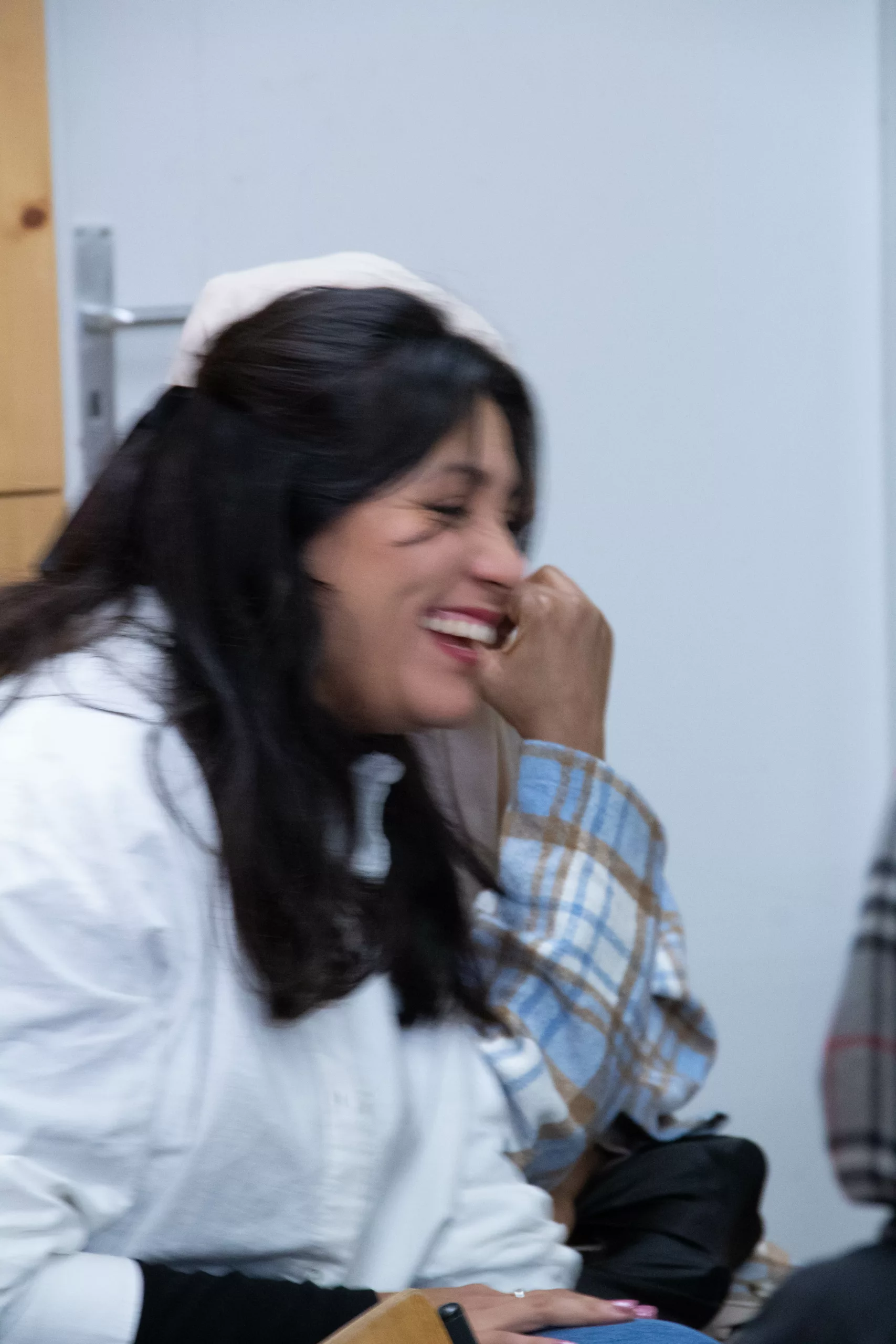 Young woman laughing heartily
