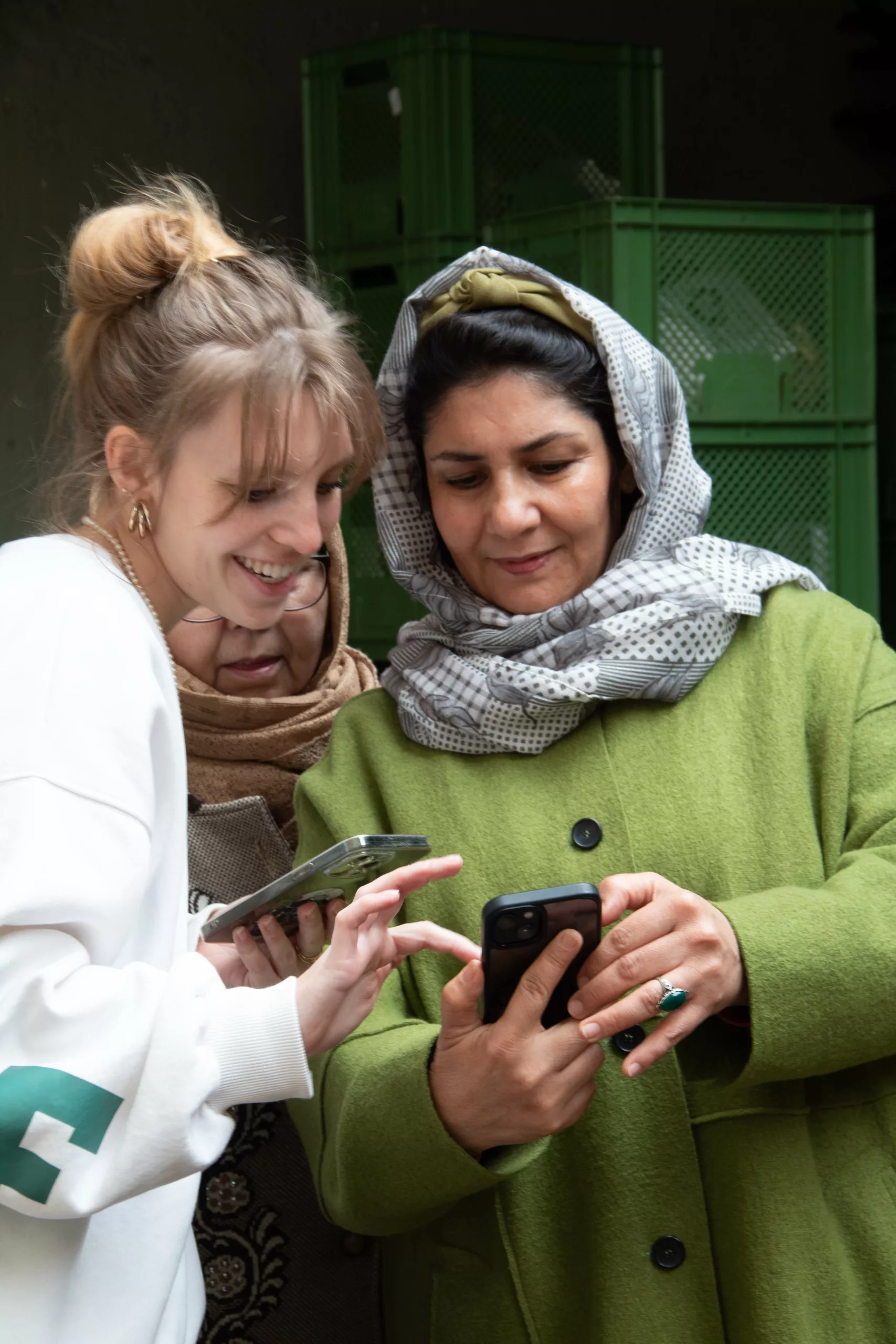 Two women looking at a phone together