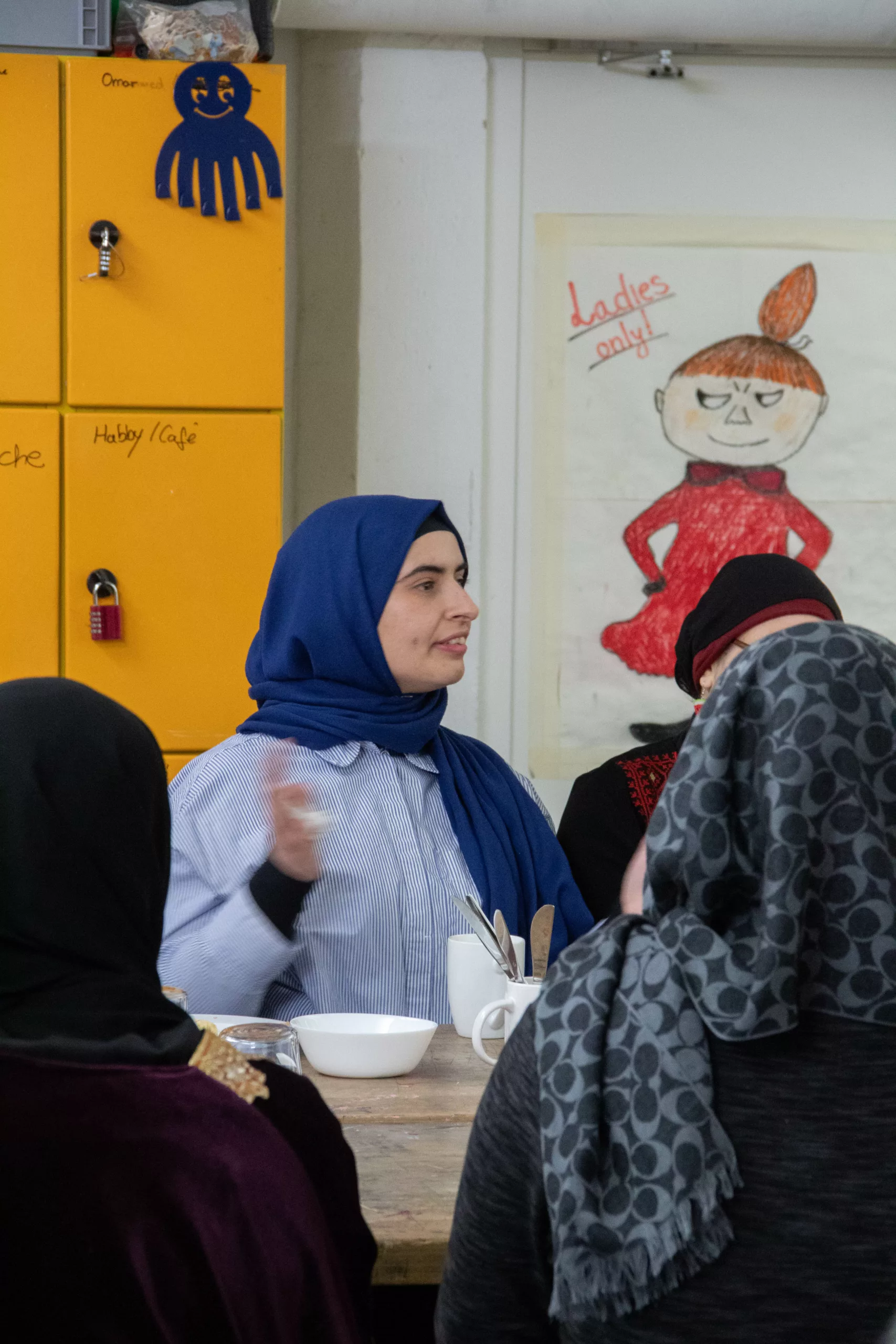 Women at the table in the women's café